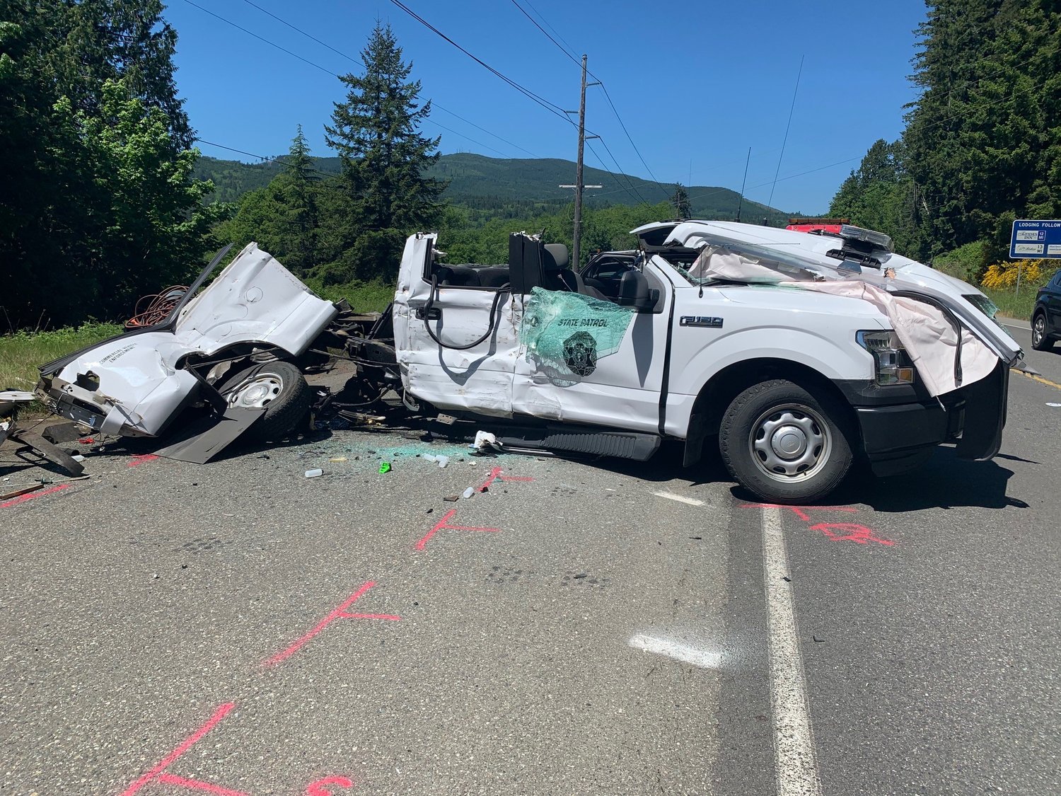 A Washington State Patrol Ford F150 was cut in two during a crash Tuesday morning on U.S. Highway 101 south of Discovery Bay. The officer in the patrol vehicle was airlifted to Harborview Medical Center with serious injuries.